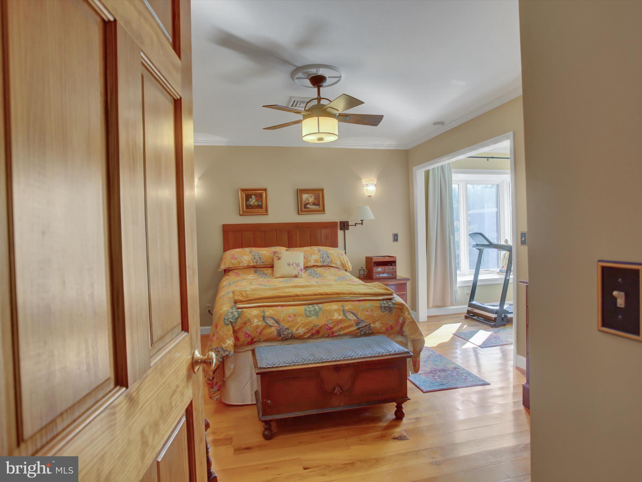 46 Pin Oak Lane Gettysburg, PA 17325 - Photo 22 of 54 a bedroom with a bed and a chandelier