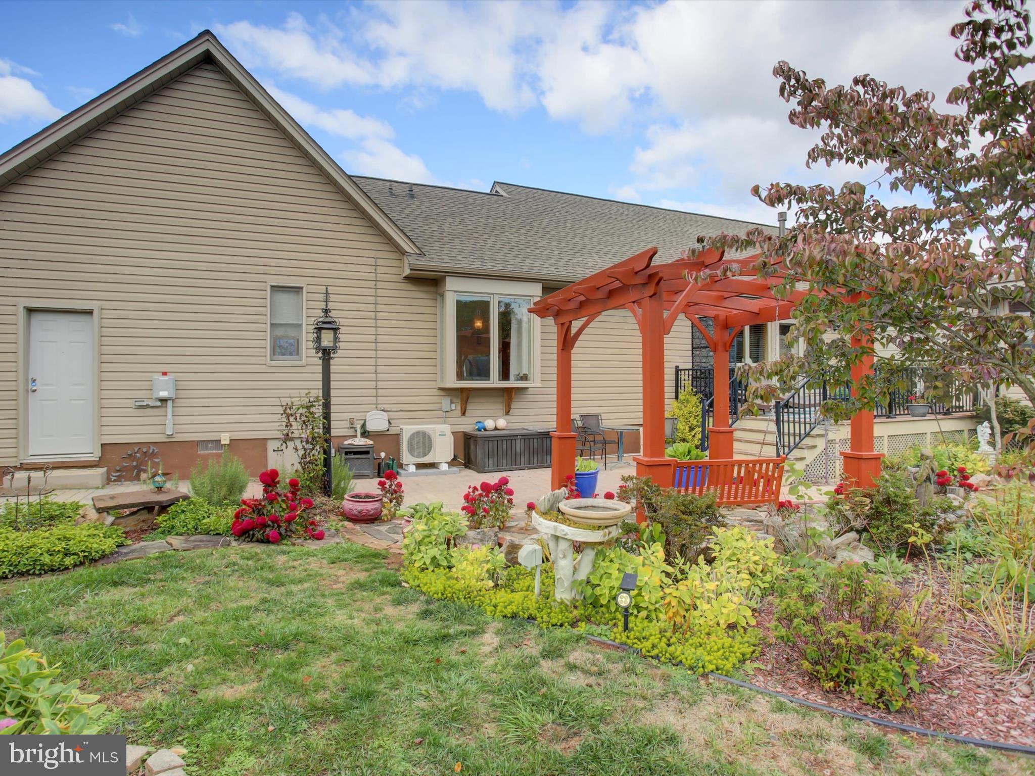 46 Pin Oak Lane Gettysburg, PA 17325 - Photo 47 of 54 a front view of house with small garden and seating area