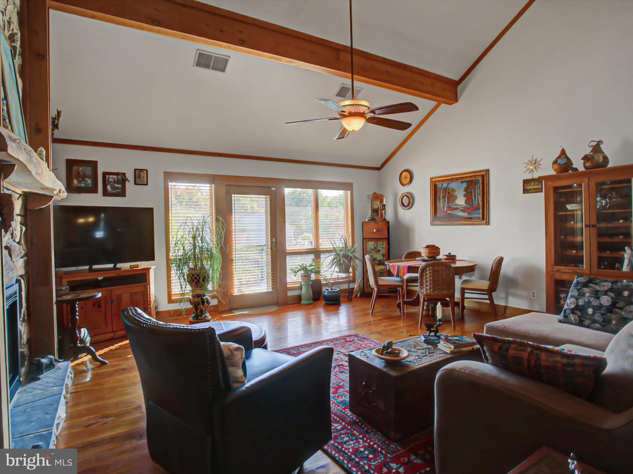 46 Pin Oak Lane Gettysburg, PA 17325 - Photo 9 of 54 a living room with furniture a flat screen tv and a large window