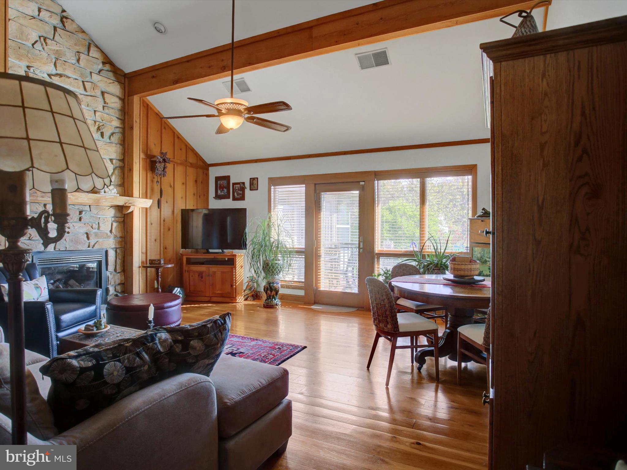46 Pin Oak Lane Gettysburg, PA 17325 - Photo 10 of 54 a living room with furniture a flat screen tv and a large window