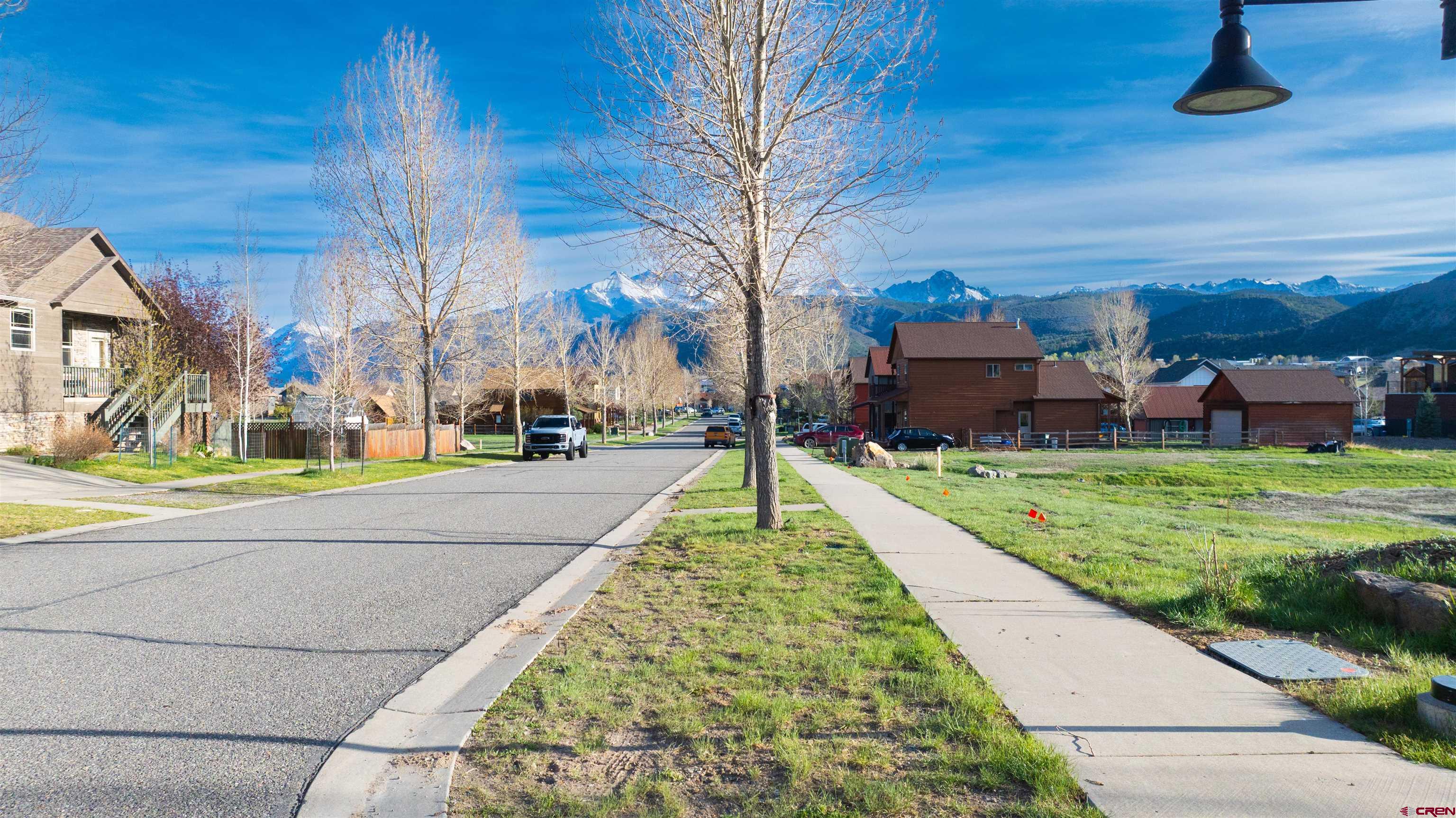 485 Kismet Street Ridgway, CO 81432 - Photo 14 of 23 a view of a house with a yard