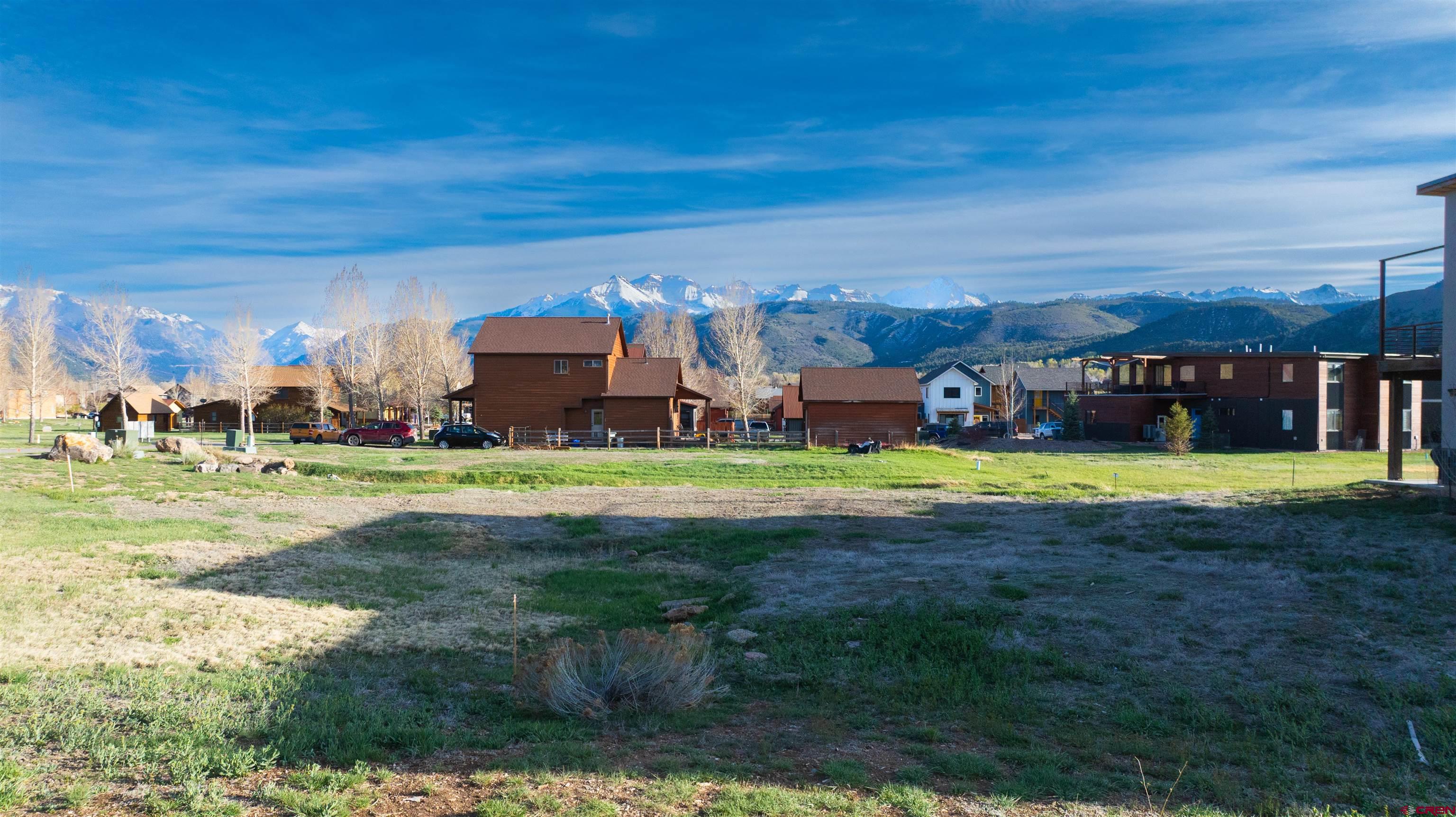 485 Kismet Street Ridgway, CO 81432 - Photo 16 of 23 a view of a building with a big yard