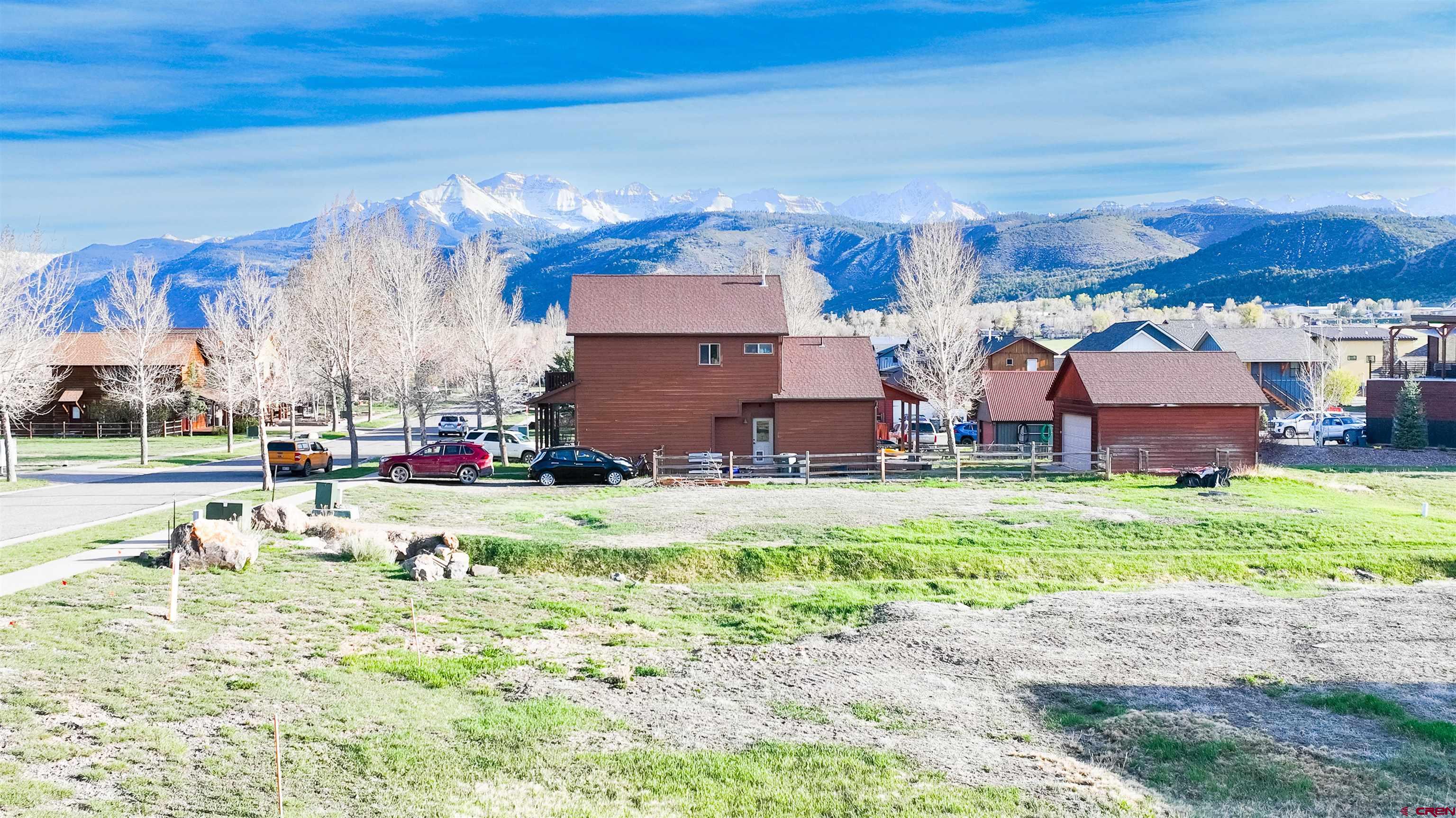 485 Kismet Street Ridgway, CO 81432 - Photo 9 of 23 a view of a house with a yard and a fountain