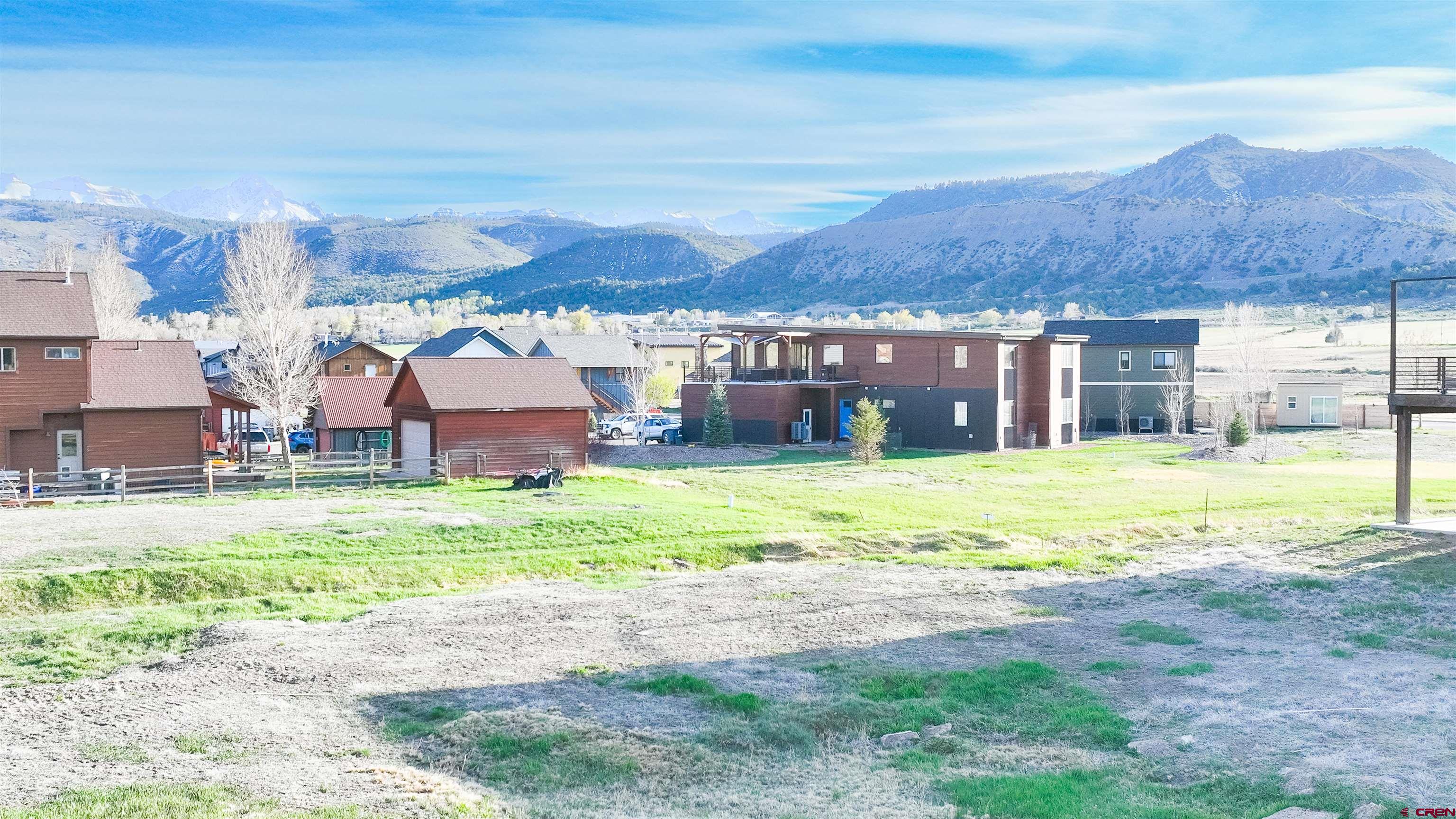 485 Kismet Street Ridgway, CO 81432 - Photo 10 of 23 a view of a house with a big yard