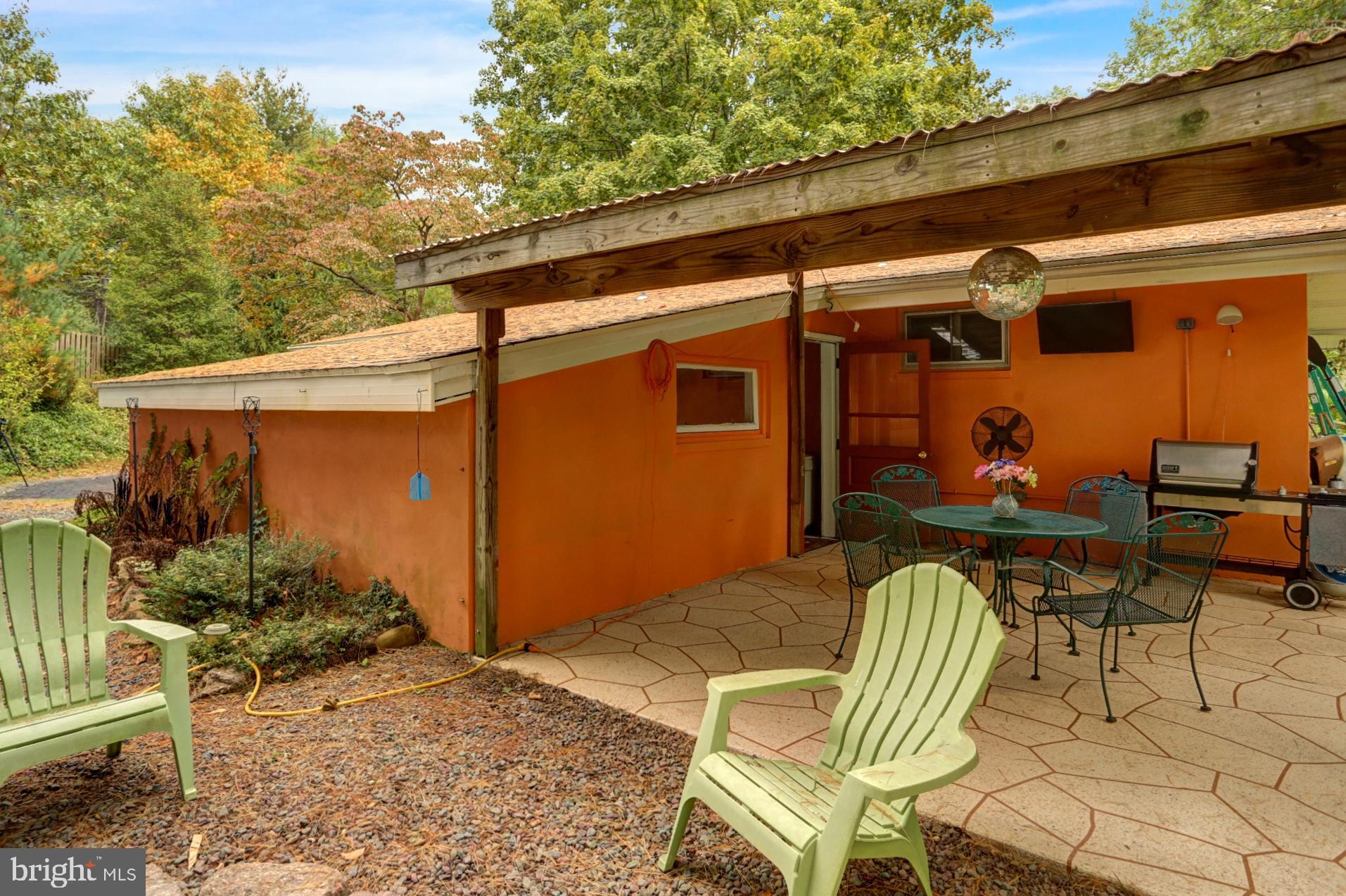 42 MacMillan Road Mohnton, PA 19540 - Photo 25 of 30 Rear Covered patio with fire pit area