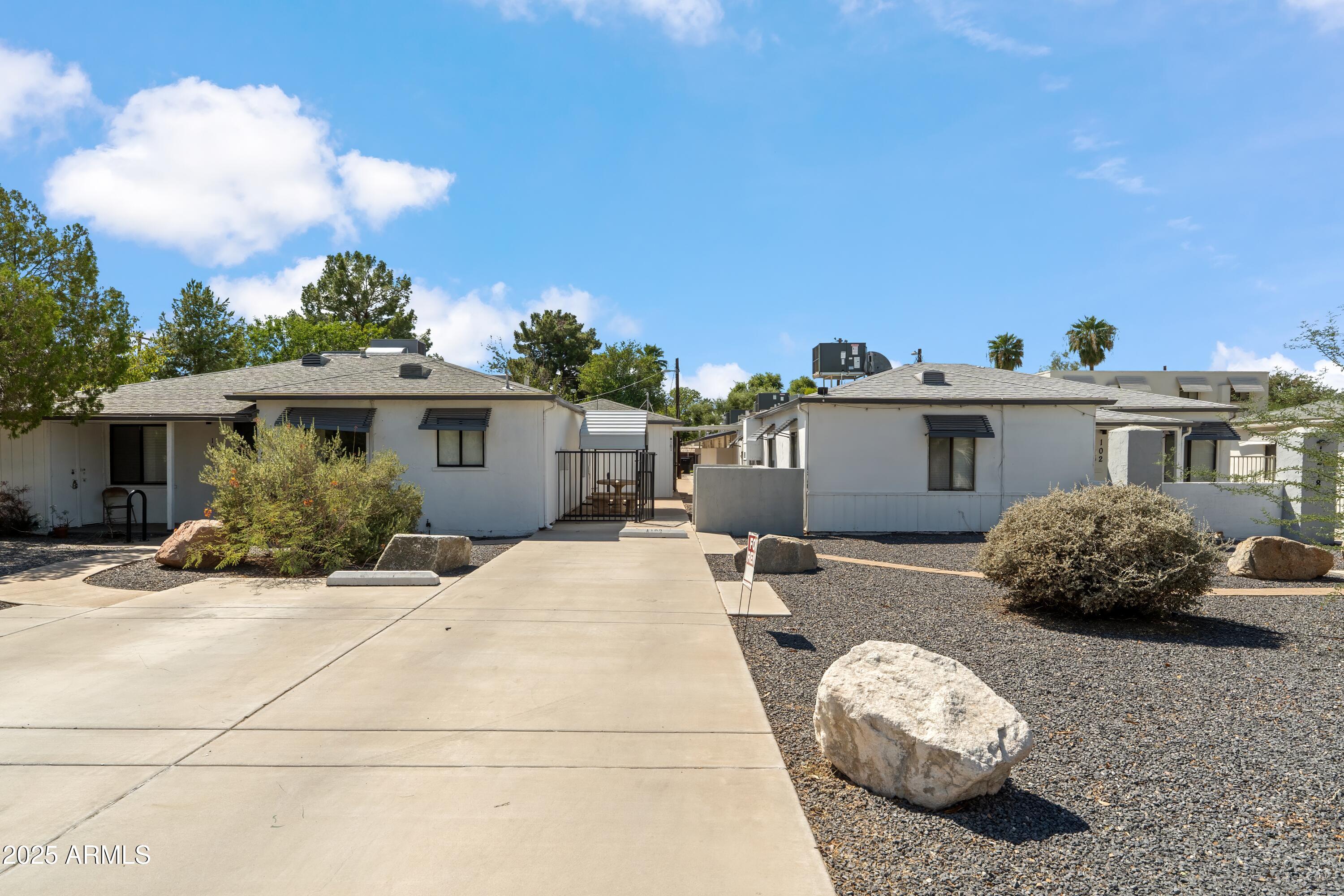 1218 South Farmer Avenue Tempe, AZ 85281 - Photo 12 of 47 a front view of a house with a yard