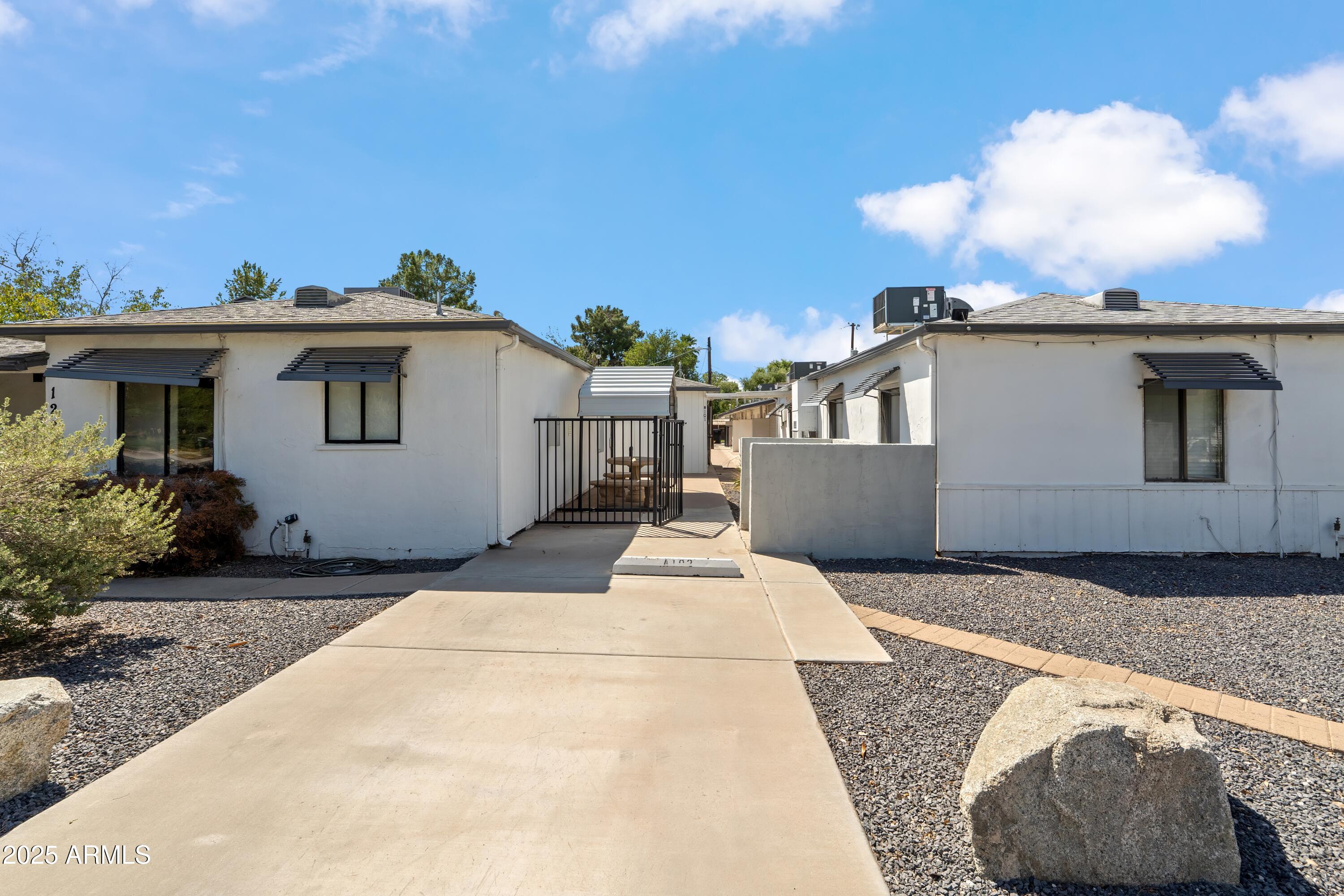 1218 South Farmer Avenue Tempe, AZ 85281 - Photo 13 of 47 a white house that has tree in front of it