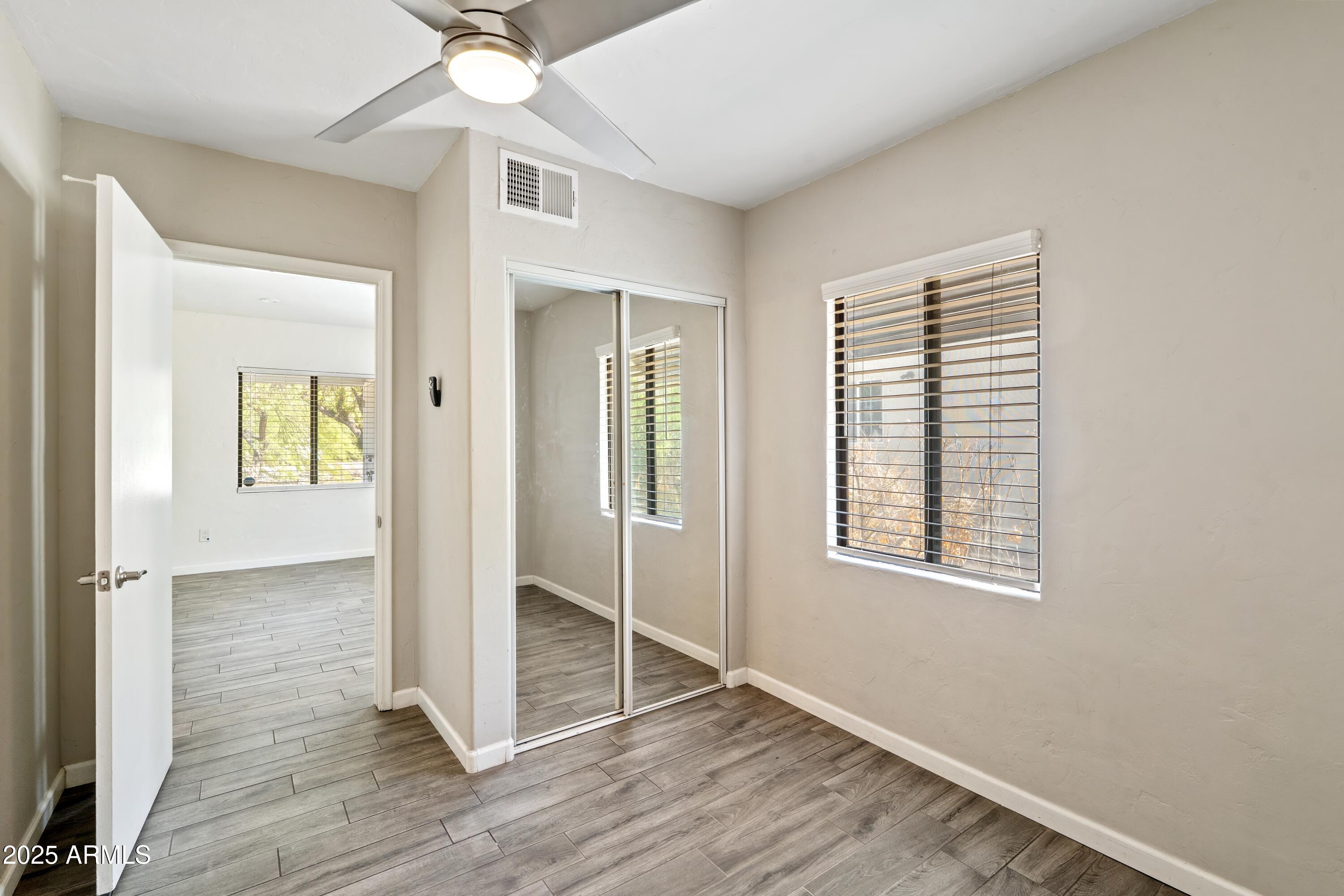 1218 South Farmer Avenue Tempe, AZ 85281 - Photo 22 of 47 wooden floor in an empty room with a window