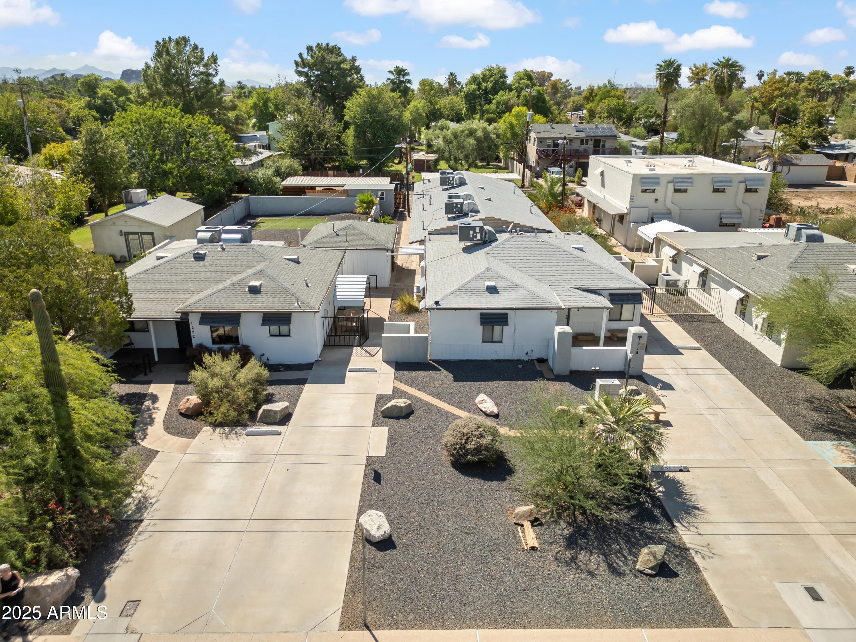 1218 South Farmer Avenue Tempe, AZ 85281 - Photo 3 of 47 a aerial view of a house with swimming pool and large trees