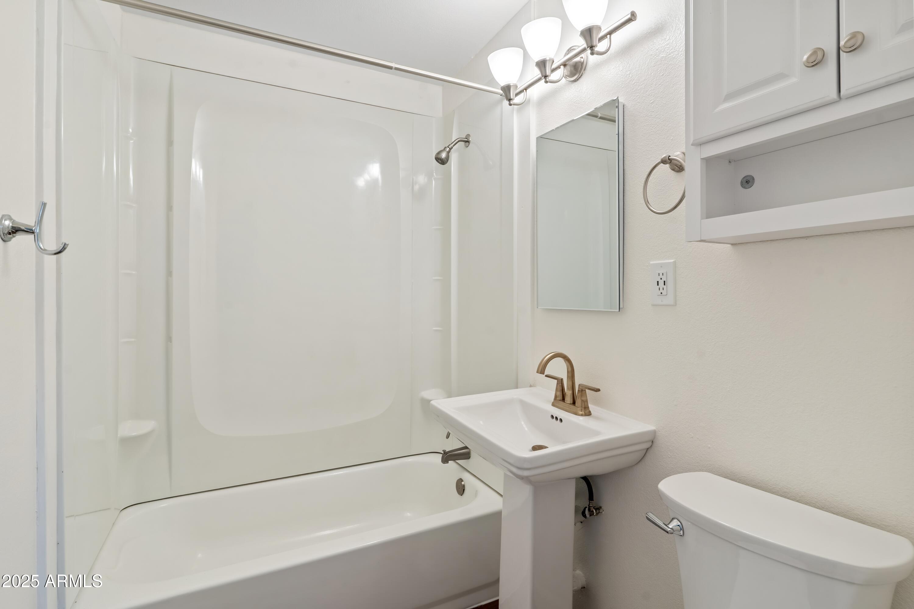 1218 South Farmer Avenue Tempe, AZ 85281 - Photo 36 of 47 a bathroom with a sink a toilet and shower