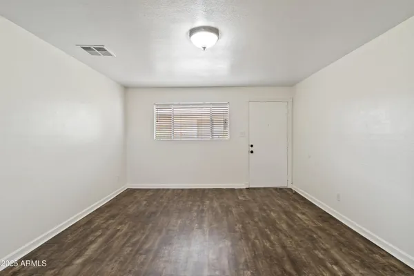 a view of kitchen with wooden floor