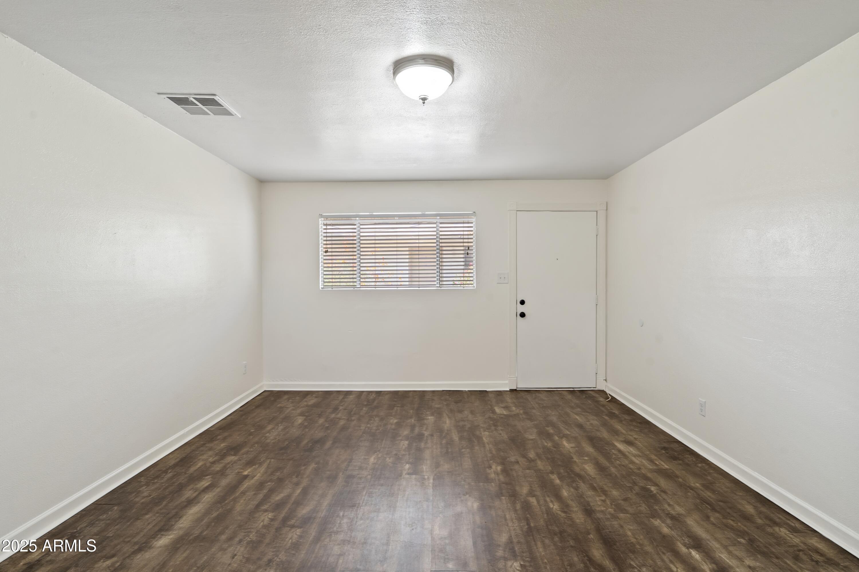 1218 South Farmer Avenue Tempe, AZ 85281 - Photo 37 of 47 a view of a room with wooden floor and a window
