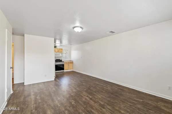 a kitchen with stainless steel appliances a refrigerator and a stove top oven