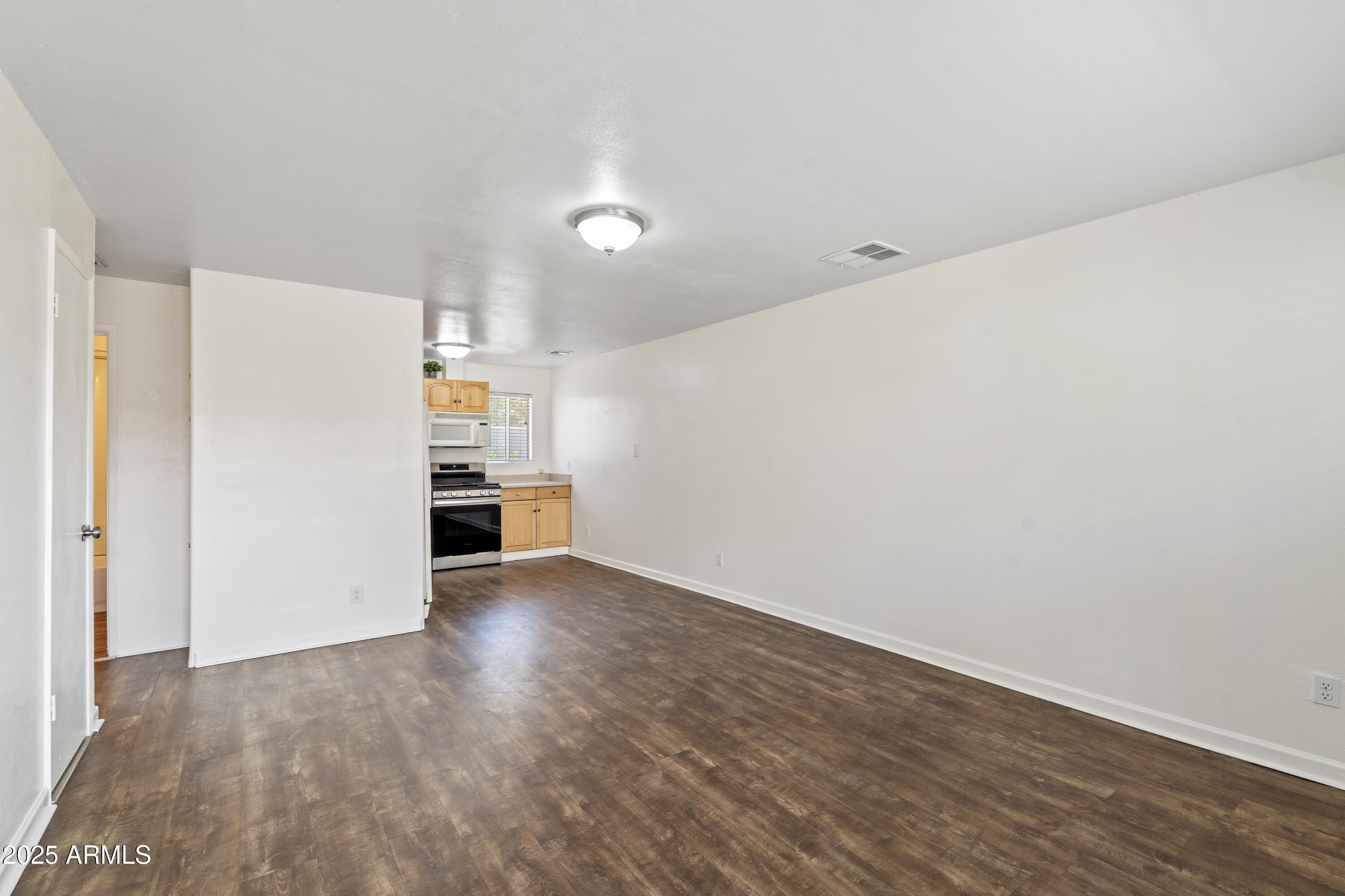 1218 South Farmer Avenue Tempe, AZ 85281 - Photo 40 of 47 a view of empty room with wooden floor