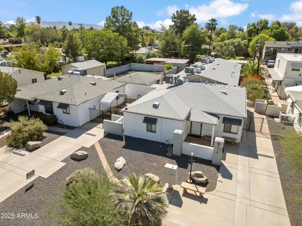 an aerial view of a house with yard swimming pool and outdoor seating