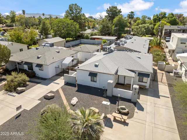 an aerial view of a house with yard swimming pool and outdoor seating