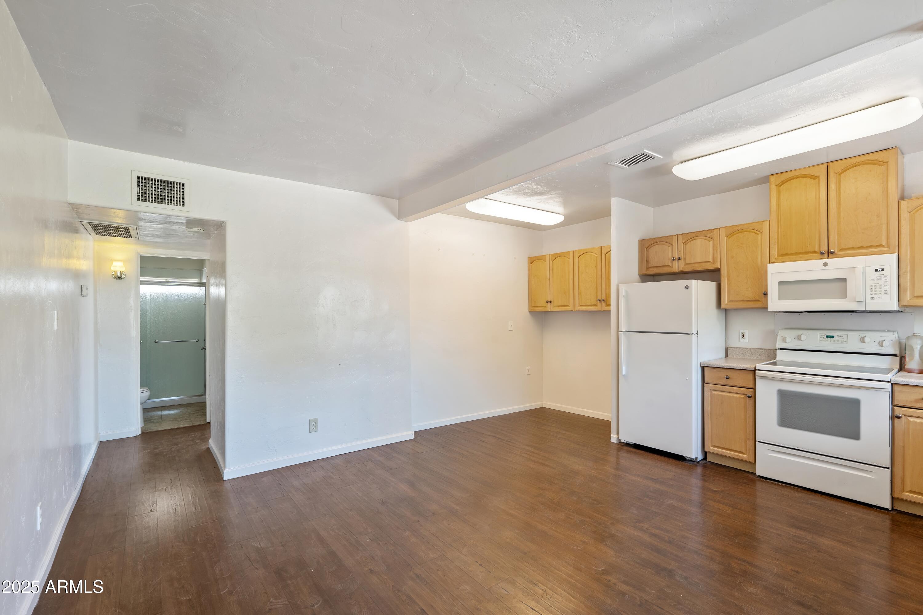 1218 South Farmer Avenue Tempe, AZ 85281 - Photo 43 of 47 a kitchen with stainless steel appliances a refrigerator and a stove top oven