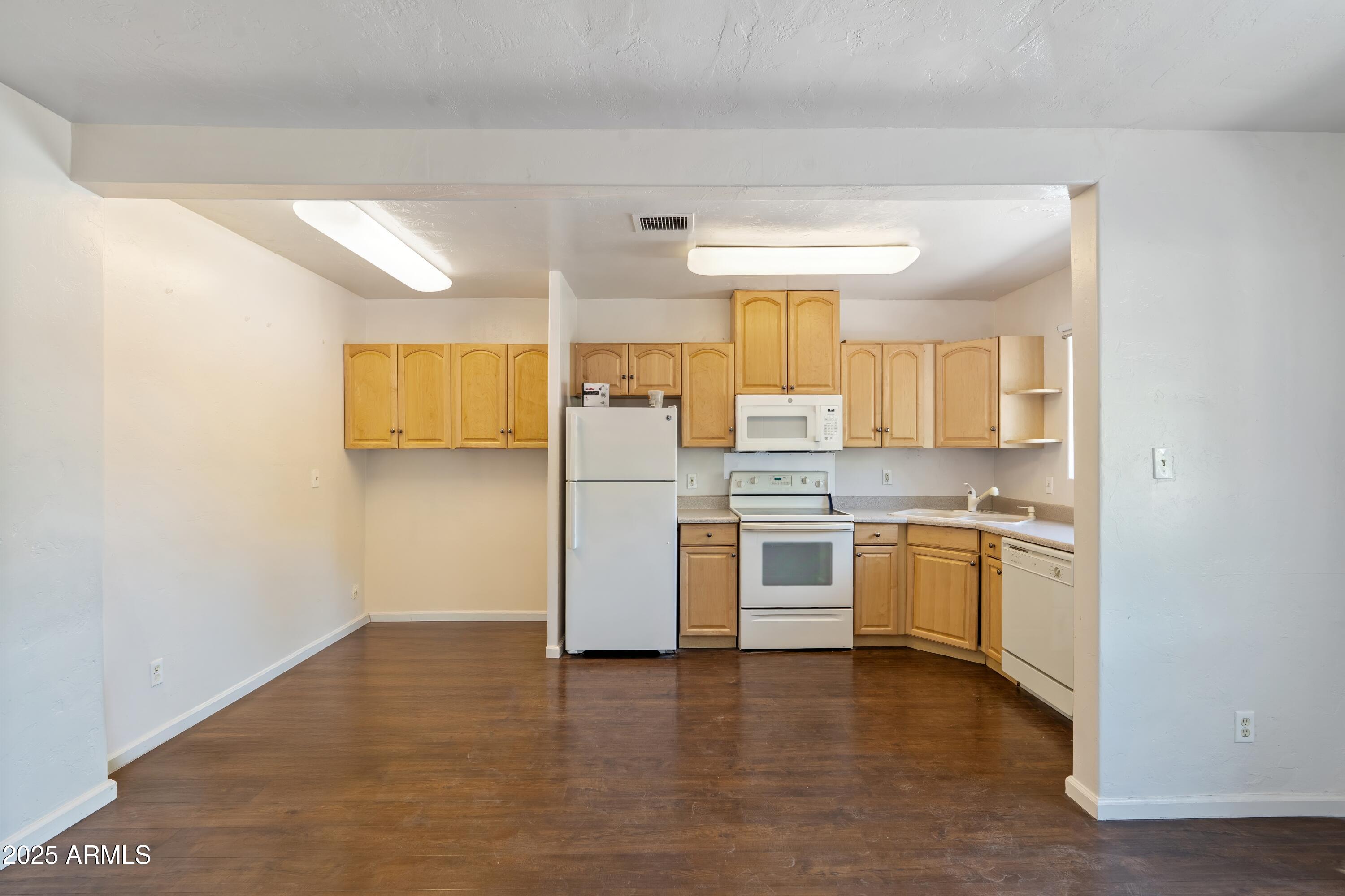 1218 South Farmer Avenue Tempe, AZ 85281 - Photo 44 of 47 a kitchen with a sink cabinets and stainless steel appliances