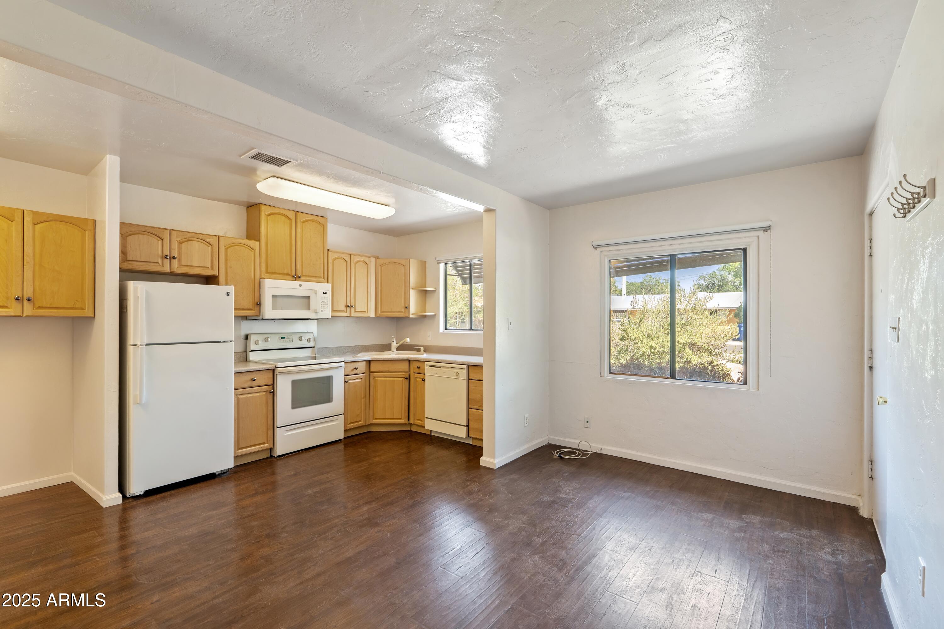 1218 South Farmer Avenue Tempe, AZ 85281 - Photo 45 of 47 a kitchen with white cabinets and white appliances