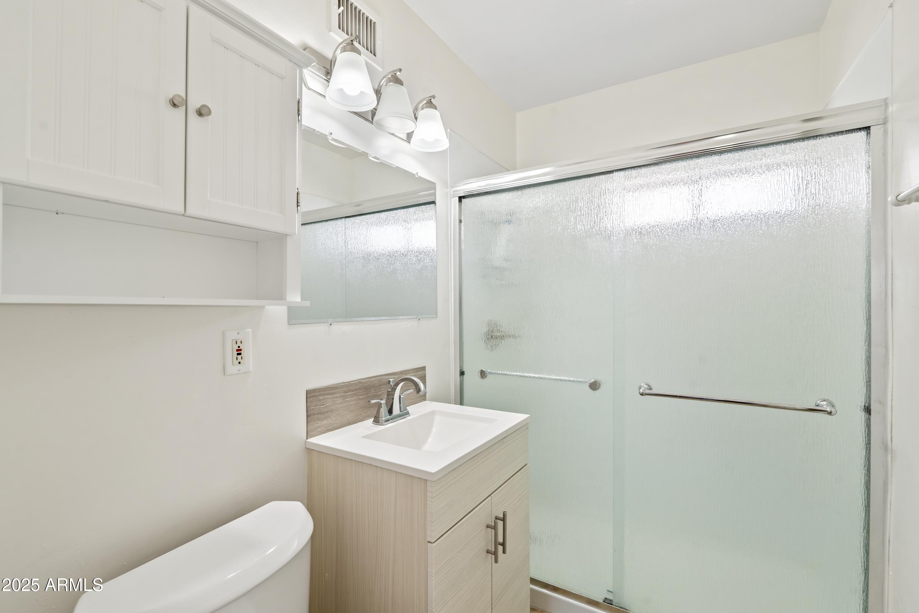 1218 South Farmer Avenue Tempe, AZ 85281 - Photo 46 of 47 a bathroom with a sink toilet and shower