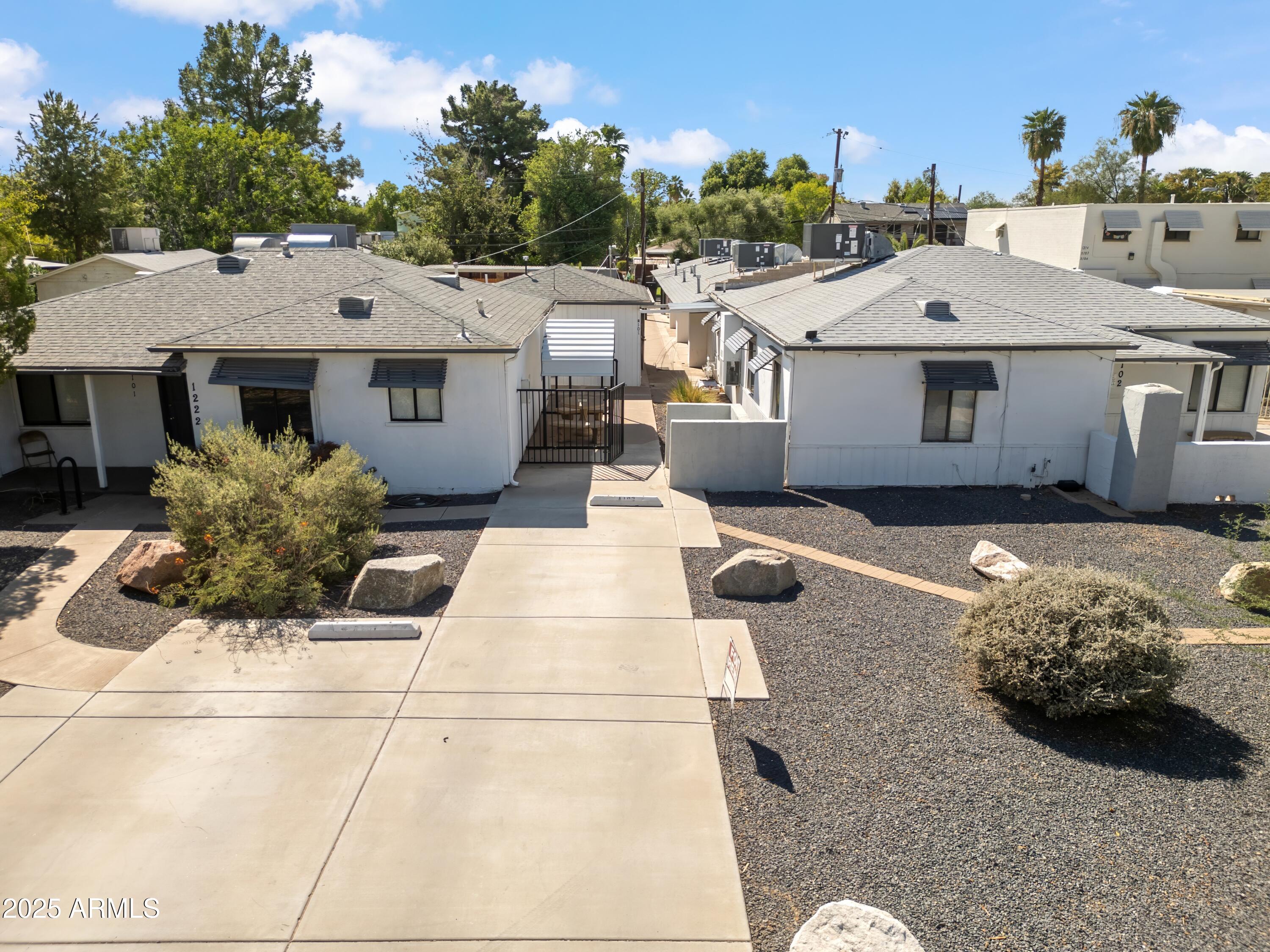 1218 South Farmer Avenue Tempe, AZ 85281 - Photo 5 of 47 a aerial view of a house with a yard