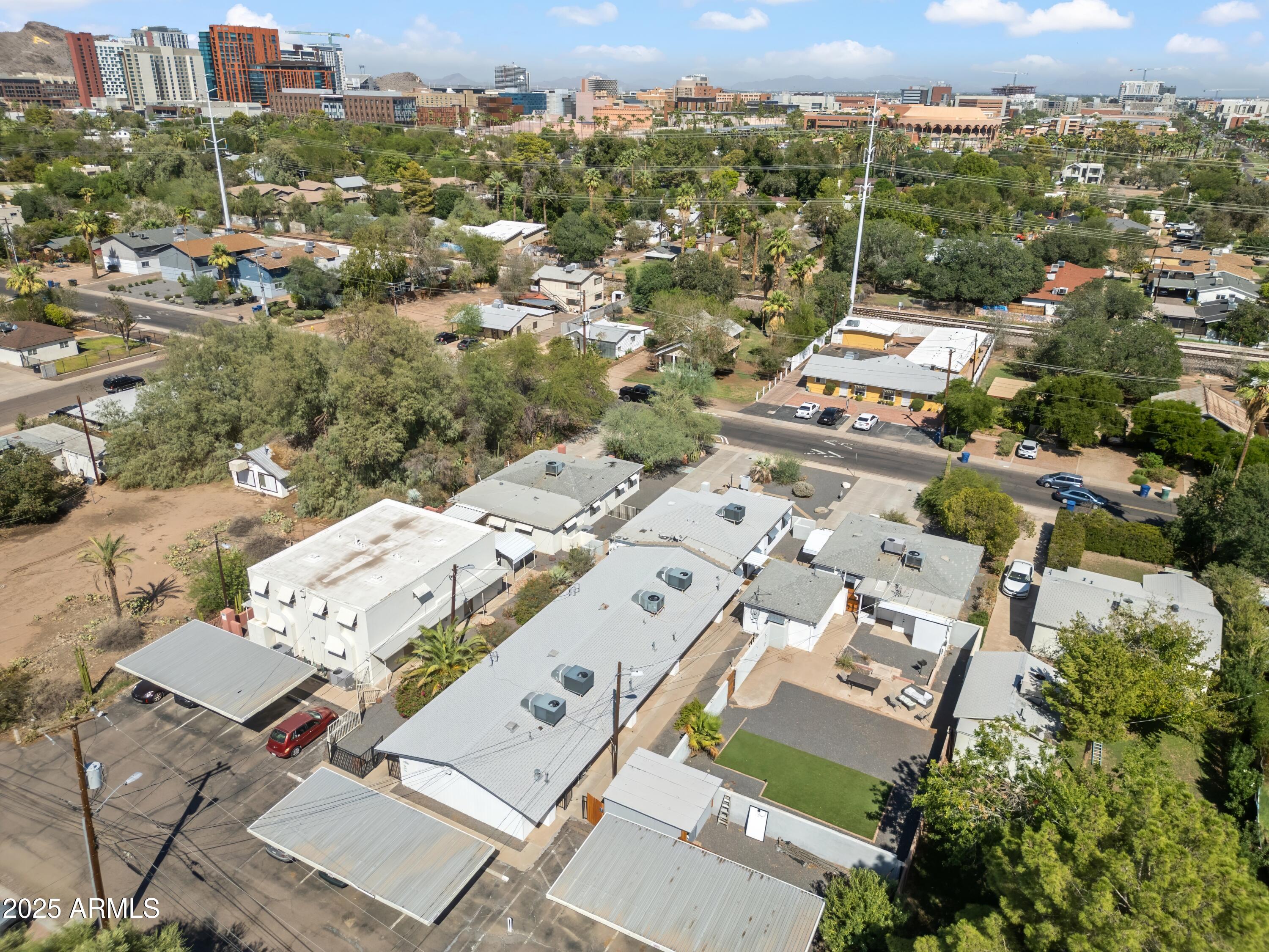 1218 South Farmer Avenue Tempe, AZ 85281 - Photo 7 of 47 an aerial view of a city with lots of residential buildings