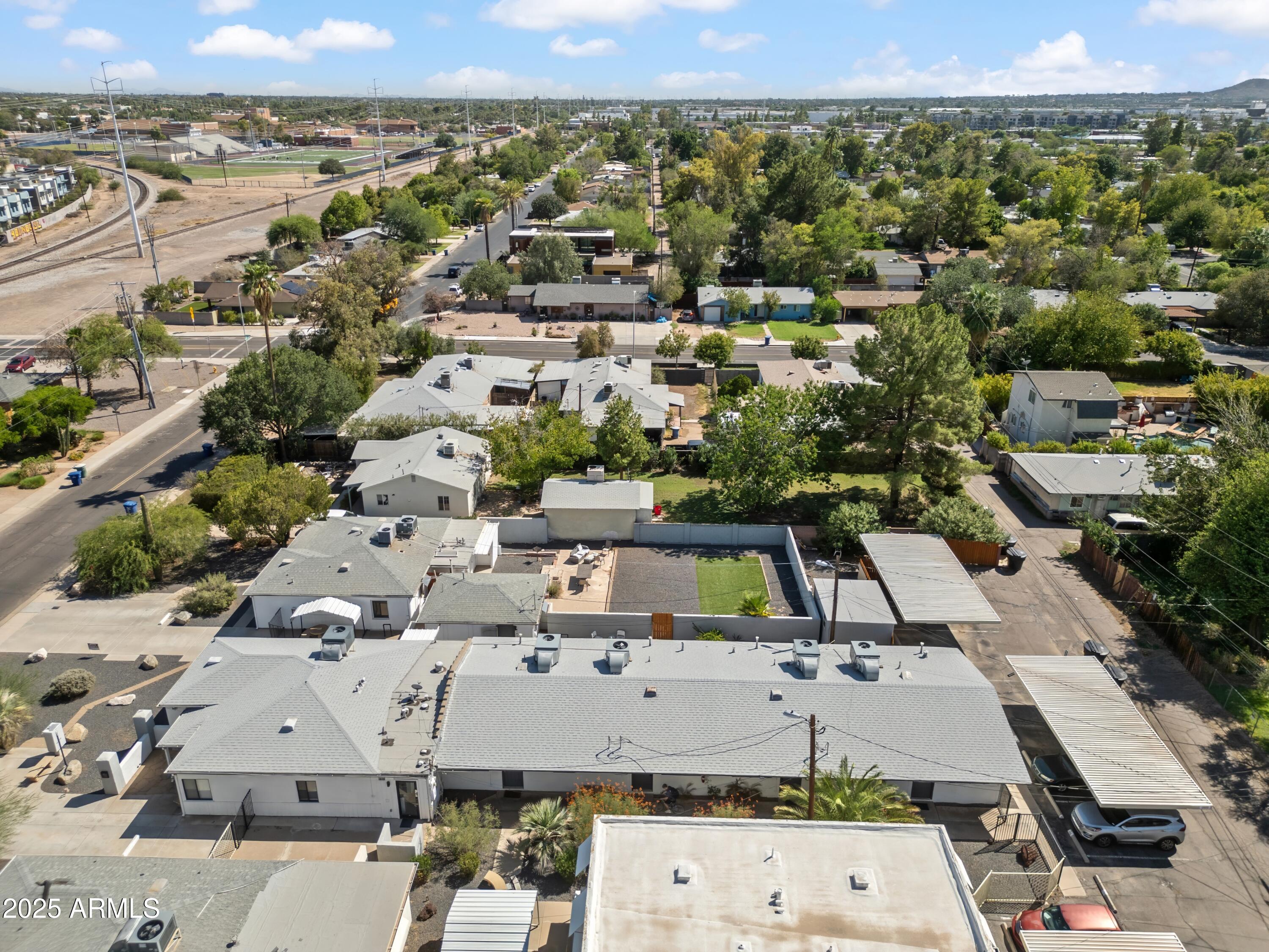 1218 South Farmer Avenue Tempe, AZ 85281 - Photo 10 of 47 an aerial view of a city with lots of residential buildings