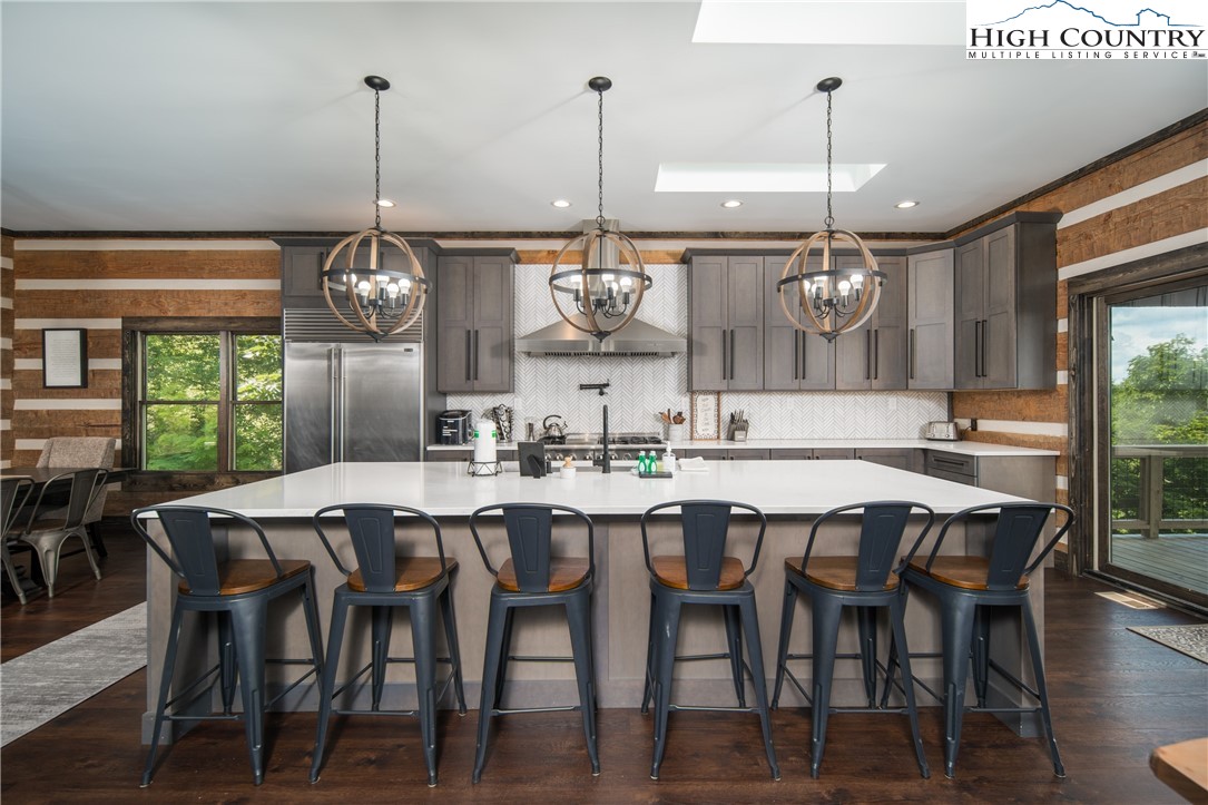 351 Broken Arrow Trail Boone, NC 28607 - Photo 12 of 48 a dining area with a table and chairs