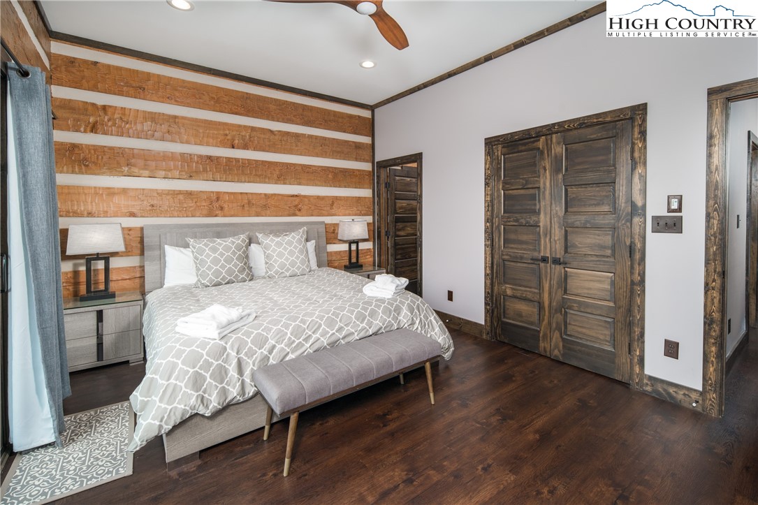 351 Broken Arrow Trail Boone, NC 28607 - Photo 23 of 48 a bed sitting in a bedroom next to a window
