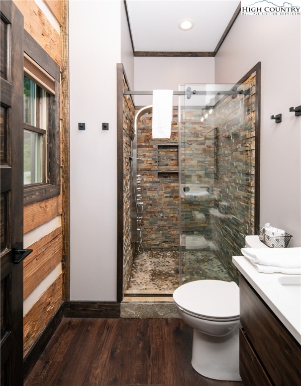 351 Broken Arrow Trail Boone, NC 28607 - Photo 26 of 48 a bathroom with a granite countertop toilet a sink and shower