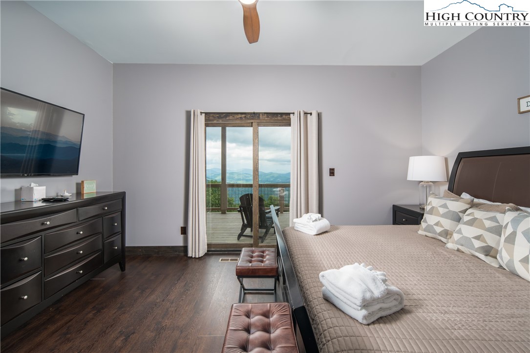 351 Broken Arrow Trail Boone, NC 28607 - Photo 30 of 48 a bedroom with furniture and a flat screen tv