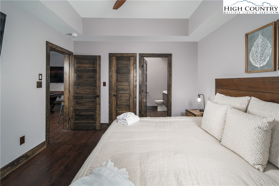 351 Broken Arrow Trail Boone, NC 28607 - Photo 36 of 48 a bedroom with a bed and a refrigerator