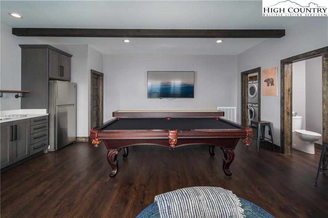 351 Broken Arrow Trail Boone, NC 28607 - Photo 42 of 48 a living room with furniture pool table wooden floor and windows