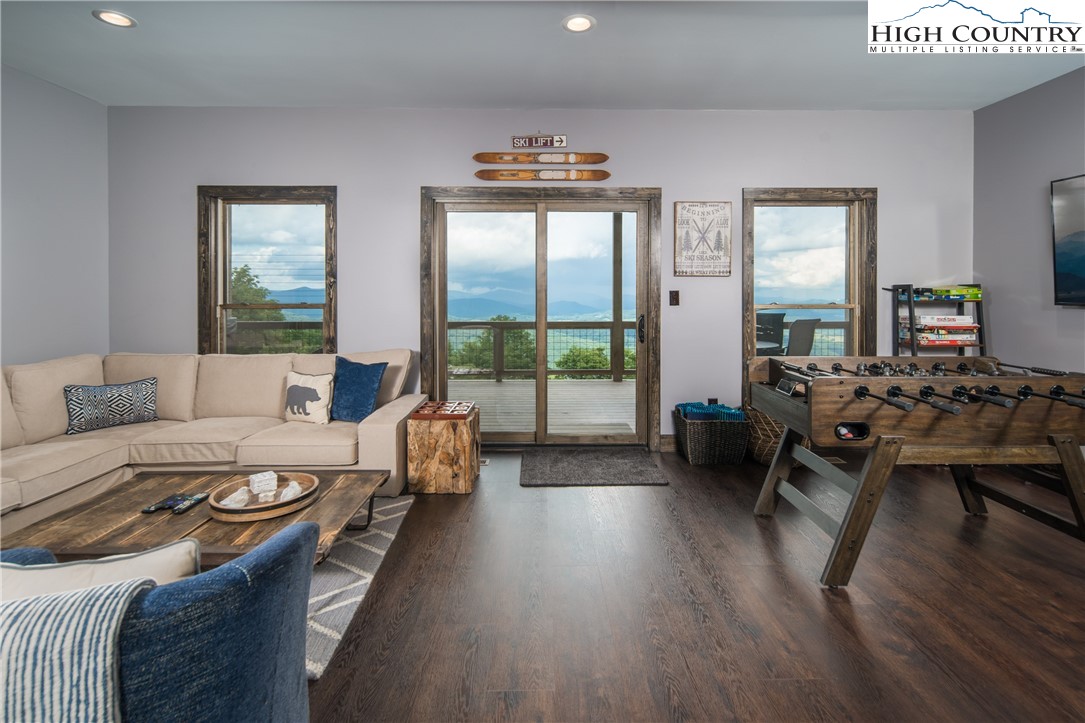 351 Broken Arrow Trail Boone, NC 28607 - Photo 43 of 48 a living room with furniture and wooden floor