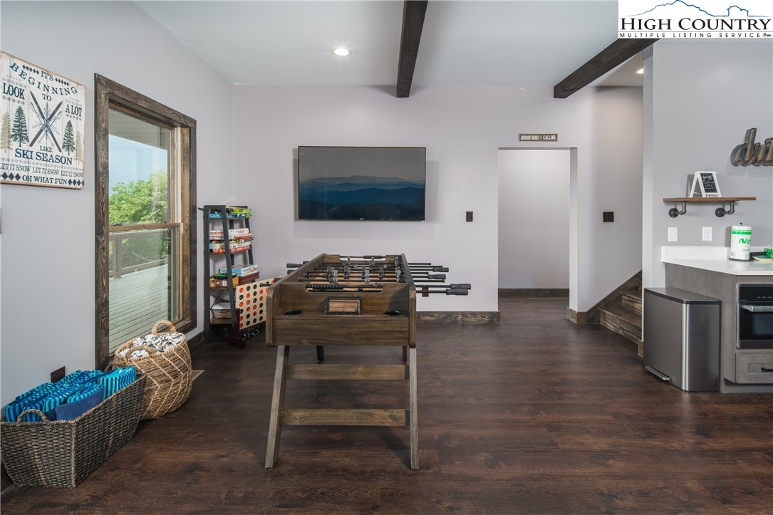 351 Broken Arrow Trail Boone, NC 28607 - Photo 44 of 48 a living room with furniture wooden floor and a flat screen tv