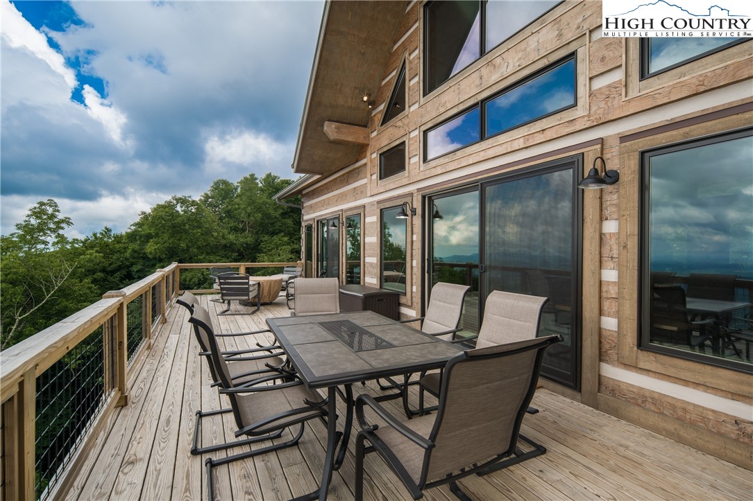 351 Broken Arrow Trail Boone, NC 28607 - Photo 7 of 48 a view of backyard with outdoor seating and wooden floor