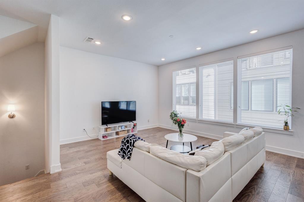 114 Chester Court Dallas, TX 75203 - Photo 11 of 31 a living room with furniture and a flat screen tv