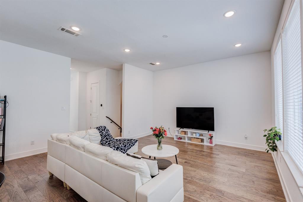 114 Chester Court Dallas, TX 75203 - Photo 12 of 31 a living room with furniture and a flat screen tv