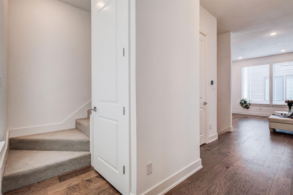 114 Chester Court Dallas, TX 75203 - Photo 17 of 31 a view of a hallway with wooden floor and furniture