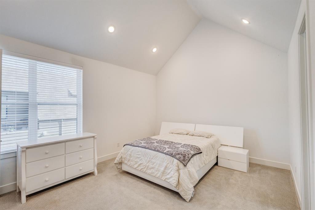 114 Chester Court Dallas, TX 75203 - Photo 20 of 31 a bedroom with a bed and a window