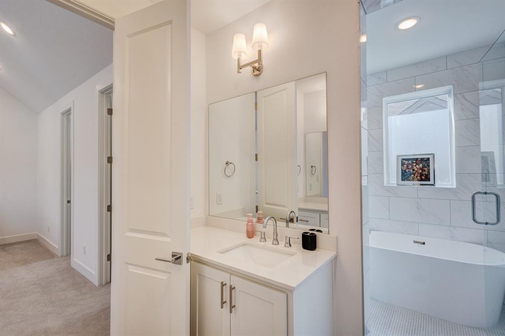 114 Chester Court Dallas, TX 75203 - Photo 22 of 31 a bathroom with a sink a toilet and shower