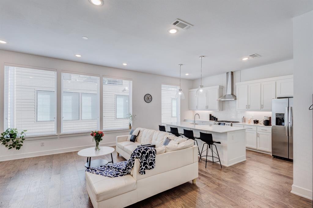 114 Chester Court Dallas, TX 75203 - Photo 9 of 31 a living room with furniture kitchen and a large window