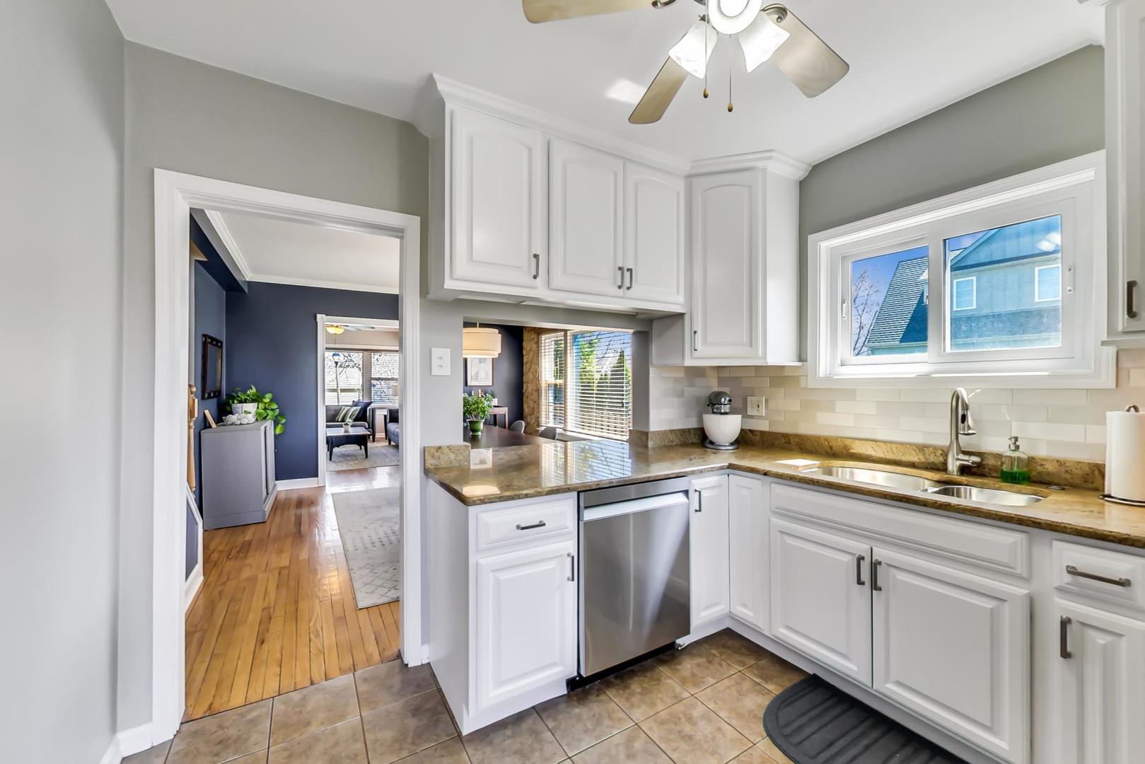 272 North Willow Road Elmhurst, IL 60126 - Photo 11 of 33 a kitchen with cabinets and window