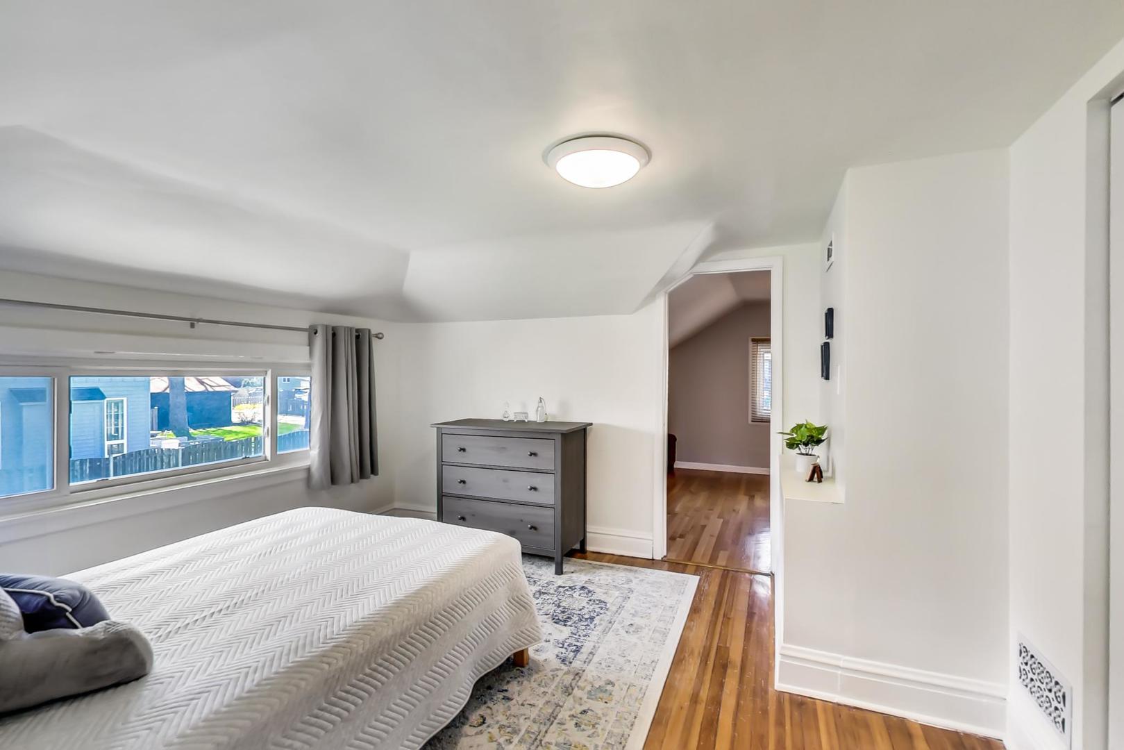 272 North Willow Road Elmhurst, IL 60126 - Photo 18 of 33 a bedroom with a bed and a dresser