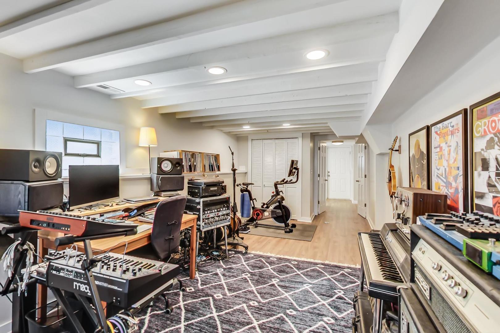 272 North Willow Road Elmhurst, IL 60126 - Photo 22 of 33 a view of a workspace with furniture and a gym