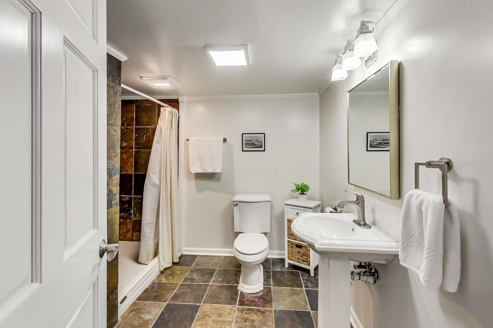 272 North Willow Road Elmhurst, IL 60126 - Photo 24 of 33 a bathroom with a sink and mirror with toilet