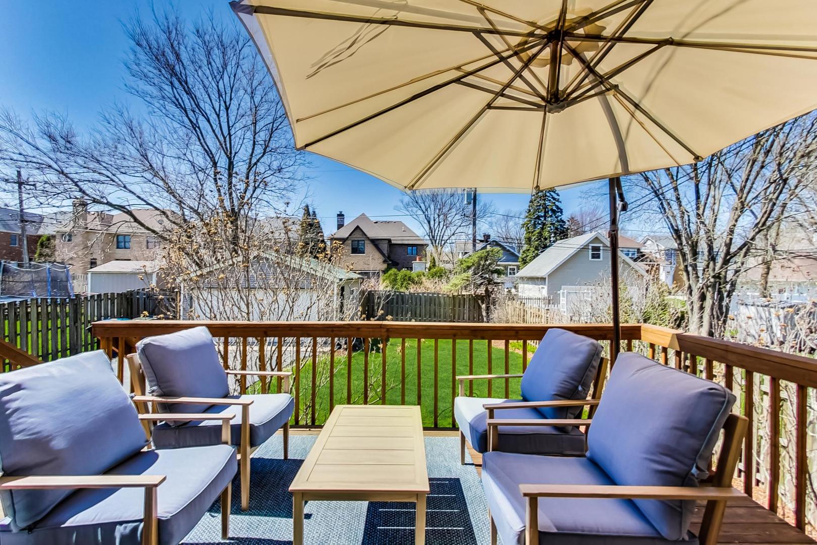 272 North Willow Road Elmhurst, IL 60126 - Photo 27 of 33 a patio with wooden floor a yard a table and chairs