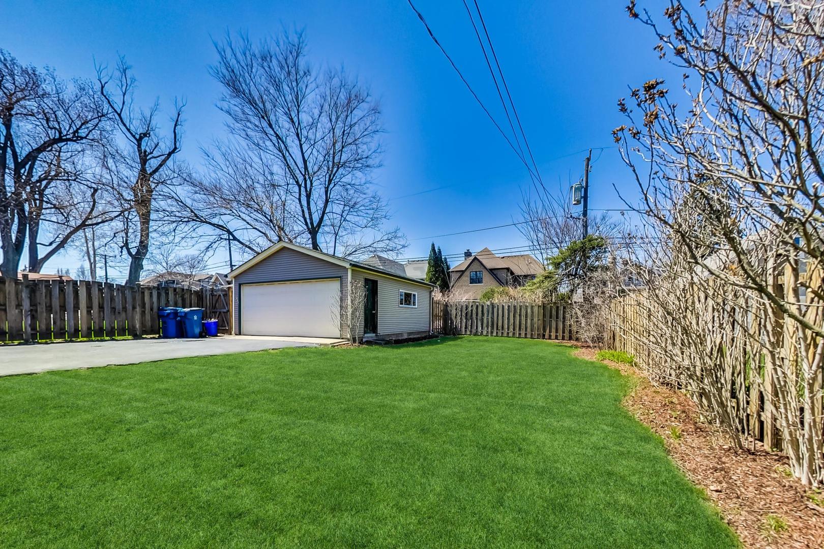 272 North Willow Road Elmhurst, IL 60126 - Photo 30 of 33 a view of a backyard with potted plants and large trees