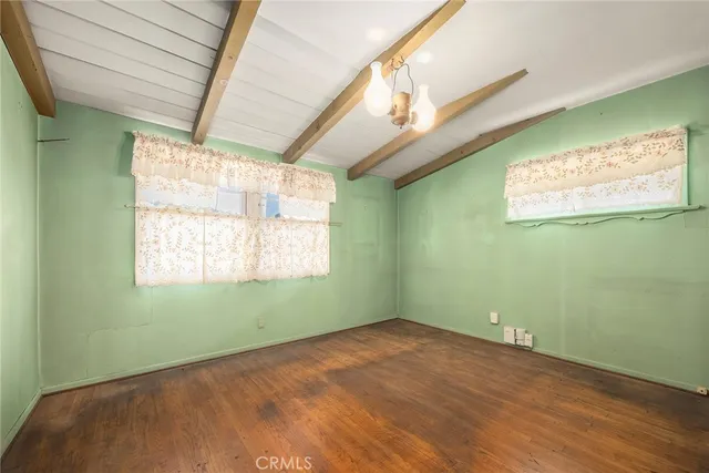 a bathroom with a tub a sink and a window