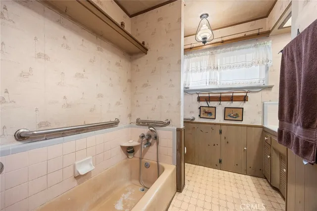 a room with gym equipment and a large window